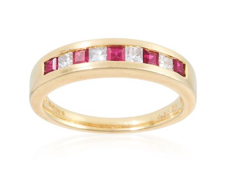 A DIAMOND AND RUBY HALF ETERNITY RING, in 18ct yellow gold, stamped 750, size M / 6, 5g.