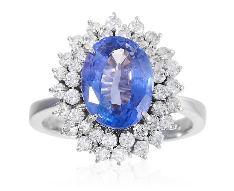 A COLOUR CHANGE SAPPHIRE AND DIAMOND RING in platinum, set with a colour change sapphire of approximately 4.46 carats in a cl