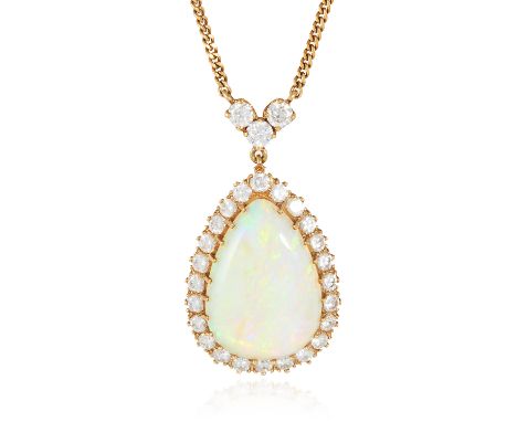 AN OPAL AND DIAMOND PENDANT NECKLACE in 18ct yellow gold, the large pear shaped cabochon encircled by round cut diamonds, bel