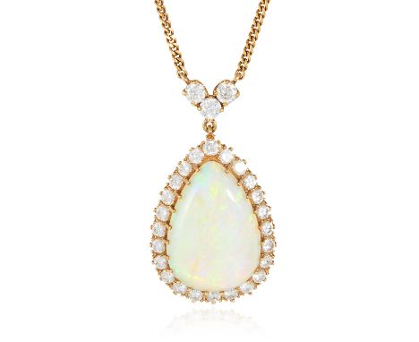 AN OPAL AND DIAMOND PENDANT NECKLACE in 18ct yellow gold, the large pear shaped cabochon encircled by round cut diamonds, bel