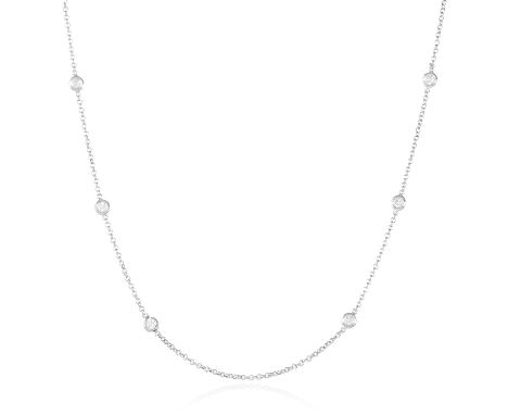 A 0.85 CARAT DIAMOND CHAIN NECKLACE in 18ct white gold, set with ten round cut diamonds totalling approximately 0.85 carats, 