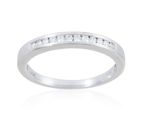 A DIAMOND DRESS RING, in 14ct white gold, totalling 0.18ct of diamonds, stamped 14K, size O / 7, 2.5g.