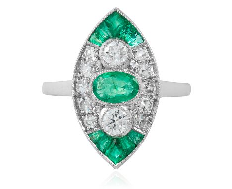 AN ART DECO EMERALD AND DIAMOND RING in platinum or white gold, the navette face set with an oval cut emerald between round c