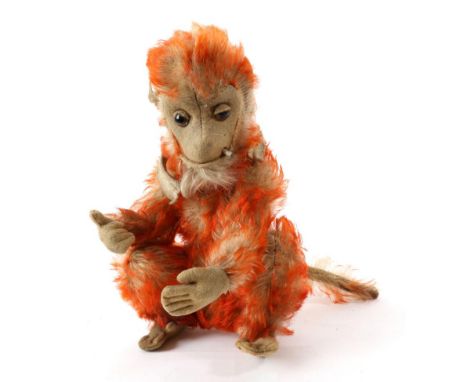 Circa 1920s Schuco Orange Tipped Mohair Smoking Monkey bent limb with jointed arms, crouched legs, stitched felt paws, brown 