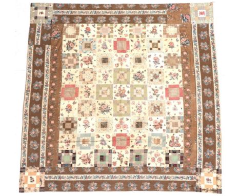 19th Century Cotton Bed Cover, comprising squares of patched or single panels of floral prints in pink, blue, green and purpl