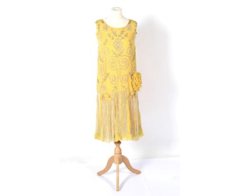 A Circa 1920s Yellow Chiffon Sleeveless Shift Dress, with multi pleated skirt hung with strings of faux pearls, silver and ot