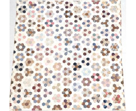 A Late 19th Century Cotton Patchwork Quilt, with hexagonal flower head pattern overall, cream to the reverse, 240cm by 225cm 