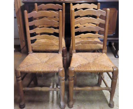 Set of four 18th/19th century oak rush seated ladder back dining chairs. Approx. 94cms H

used condition with scuffs, scratch