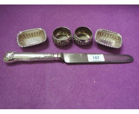 A Georgian silver handled dinner knife having scallop shell decoration to terminal, Sheffield 1823, Aaron Hadfield, a pair of