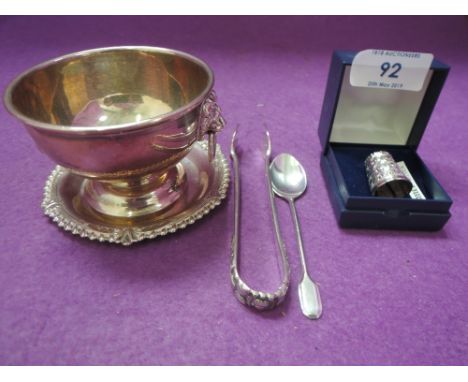 A small selection of HM silver and white metal stamped 800S including sugar bowl having lion mask handles, cased thimble, sau