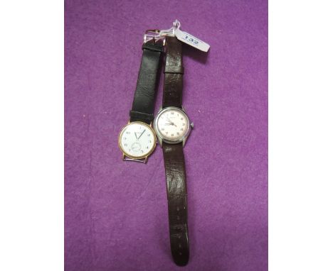 A gents wrist watch by Envoy having an Arabic numeral dial with red minute perimeter dial in steel case on brown strap, and a