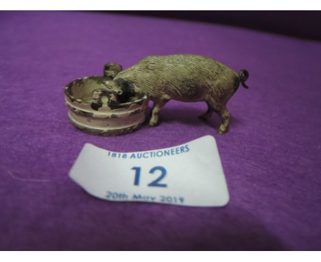 A cold painted bronze figure of a farm yard pig feeding bearing stamp to base