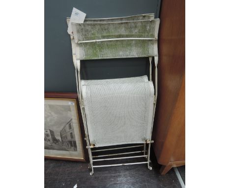 A pair of vintage metal folding garden chairs