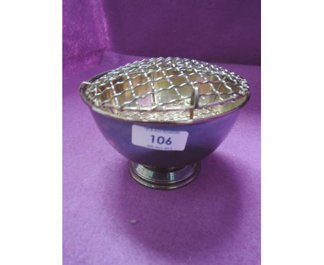 A silver rose bowl of plain circular form bearing presentation inscription to base of pedestal foot, Sheffield 1975, James Di