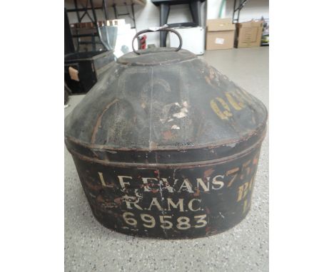 An early 20th century hat box with tin and pressed body bearing luggage badge and stencilled Bolton Lancs L.F Evans R.A.M.C R