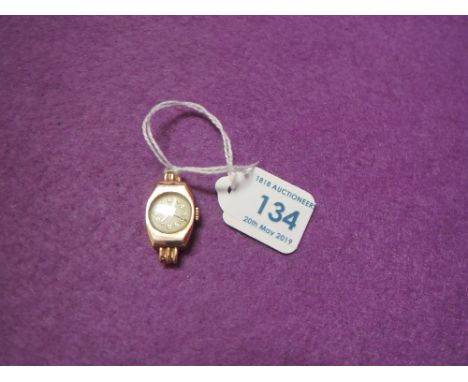 A lady's vintage 9ct gold wrist watch having Arabic numeral dial, no strap