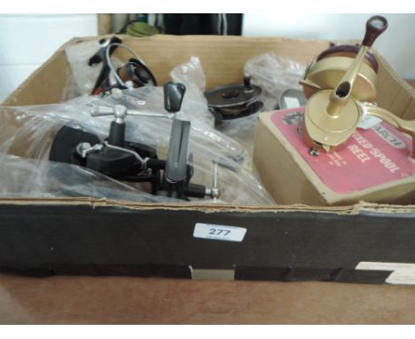 A selection of vintage fishing reels including 1st edition Monarch