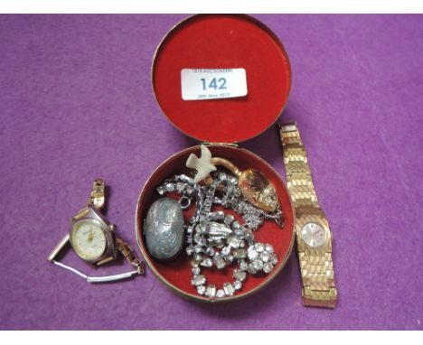 A small trinket box containing two lady's gold plated watches, diamante necklace and earrings, HM silver patch box etc