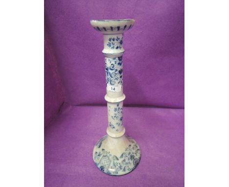 A large blue and white candle stick hand decorated standing 1ft high