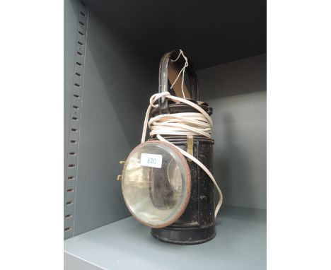 A vintage railway lamp, converted to electric (wiring removed)