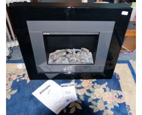 A Dimplex Optimyst wall engine (heater) with instructions