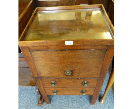 A George III mahogany night stand with tray top over a hinged cupboard door and pull-out one step commode dummied as two draw