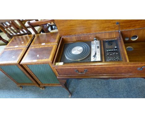 A Dynatron Goldring radiogram in cross-banded walnut cabinet, 98cm long, with a set of four matching speakers (5)