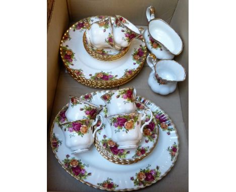 A Royal Albert Old Country Roses tea service, 6 dinner plates, side plates, cups and saucers, one sandwich plate and two jugs