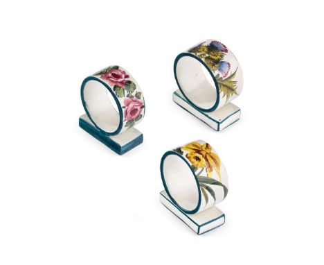  WEMYSS WARE THREE NAPKIN RINGS to include 'CABBAGE ROSES' NAPKIN RING, glazed earthenware, impressed maker’s mark WEMYSS, 6c