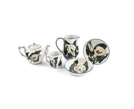   'ARUM LILIES' PART TEA SERVICE glazed earthenware, painted by Karel Nekola, Edwin Sandland, comprising a TEAPOT, 11cm high;