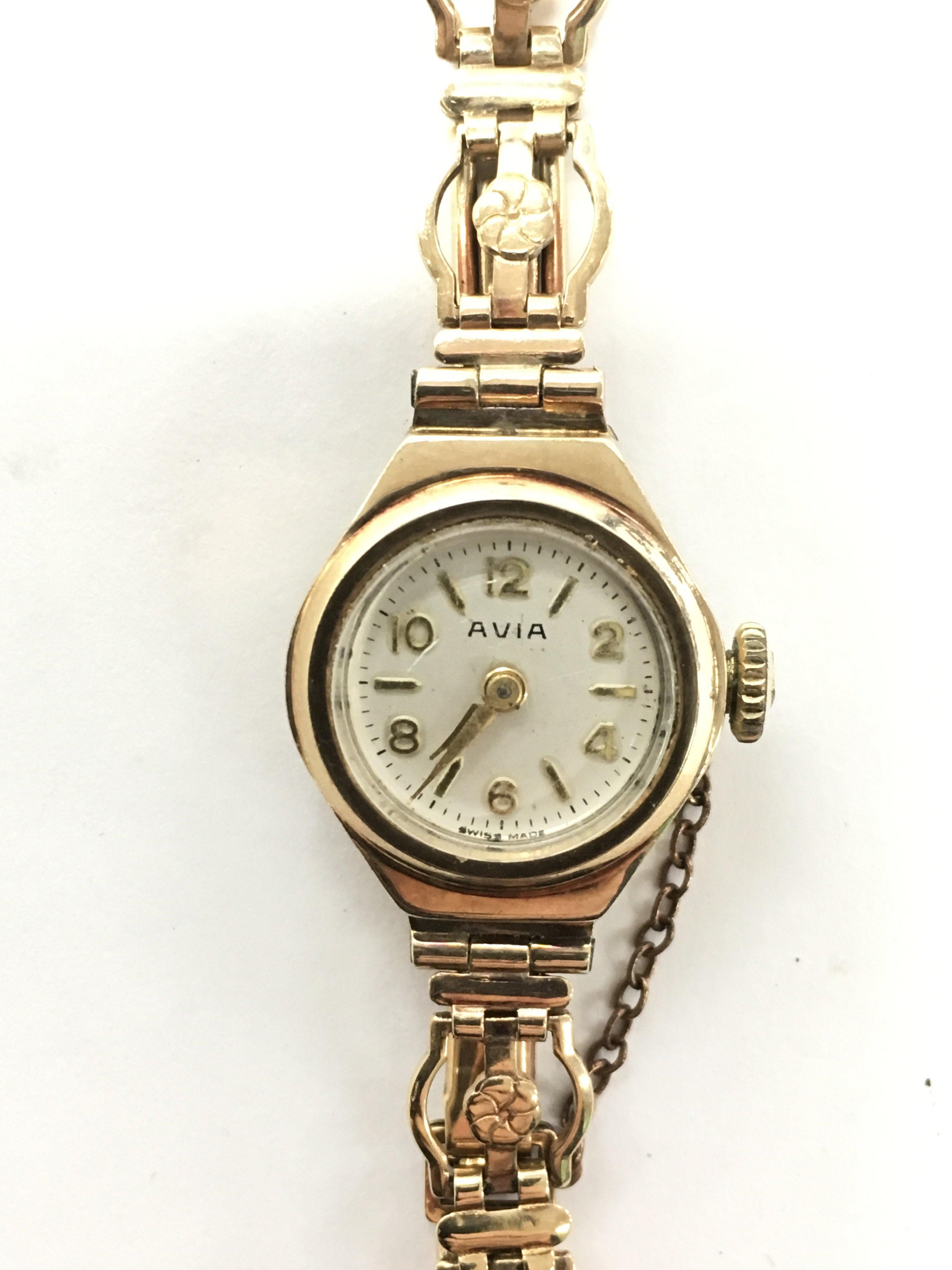 A ladies 9ct gold cased Avia mechanical wristwatch, mounted on a 9ct ...