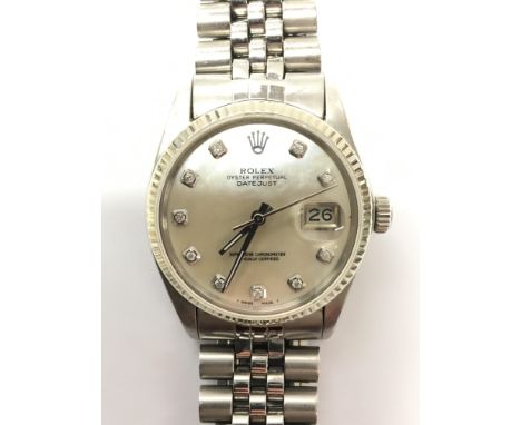 A Rolex oyster perpetual Datejust chronometer wristwatch with pearlescent dial and diamond set hour indicators, magnified dat