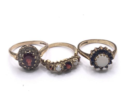 Three 9carat gold rings set with Opal and garnets and small ruby total weight 7.5g