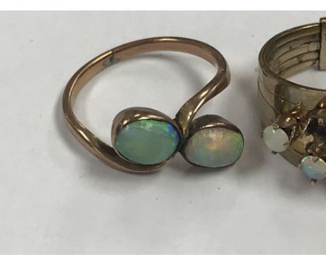 Two unmarked Opal rings together with a pair of opal earrings and one 9 ct gold ring .