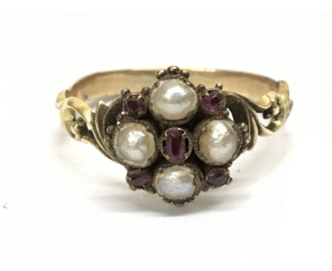 A gold ring antique set with Pearl and ruby, size N/O. 2.55g. Postage cat A