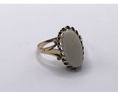 A 9carat gold ring set with an oval Opal ring size O.weight 3g