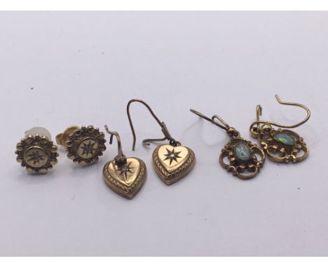 Three pairs of gold earrings set with chip stone diamond and Opal. Weight 6g