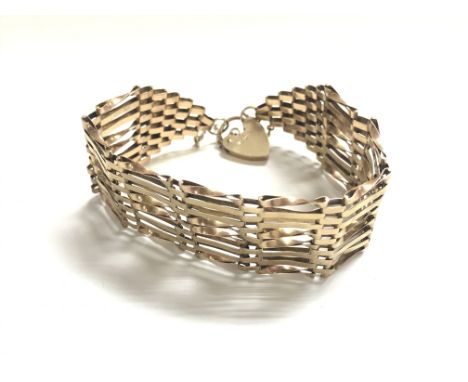A 9ct gold gate bracelet. 16.93g