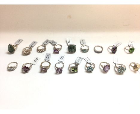 A collection of silver rings in various styles set with assorted gems including opal and Aquamarine etc. All with COAs.