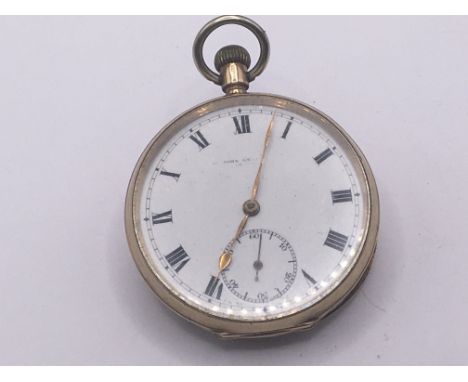 A 9carat gold button wind pocket watch with gold inner back plate seen working. The case with dents but no personal inscripti