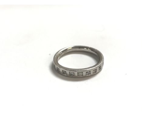 A platinum and diamond half eternity ring. Size K 1/2 and 5.53g.