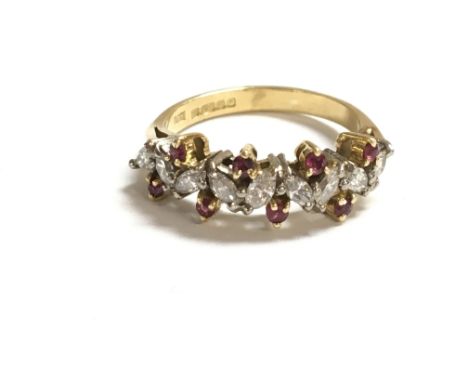 An 18ct gold diamond and ruby ring. 4.65g size N 1/2