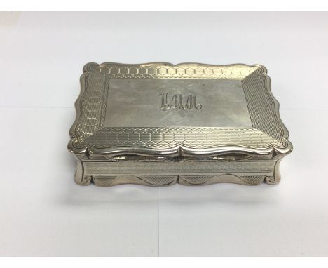 A silver snuff box with engine turned decoration. Birmingham hallmarks. Approx width 8.5cm. Shipping category A.