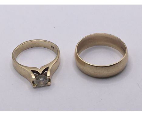 A 9carat gold ring inset with a solitaire diamond ring size k and a 9carat gold wedding ring. Weight 6g ring size (2)