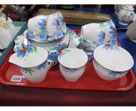 Collingwood Teaware, of twenty pieces, decorated with light blue and red flowers, the handles as flowers.