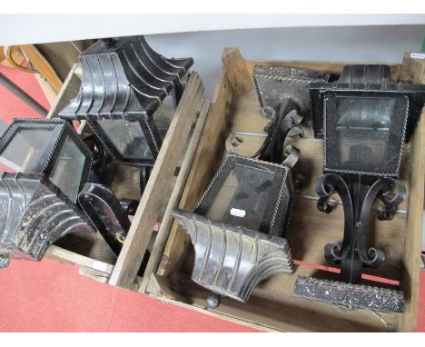 A Set of Four External Black Painted Light Fittings, with pagoda tops, in two wooden fruit crates.