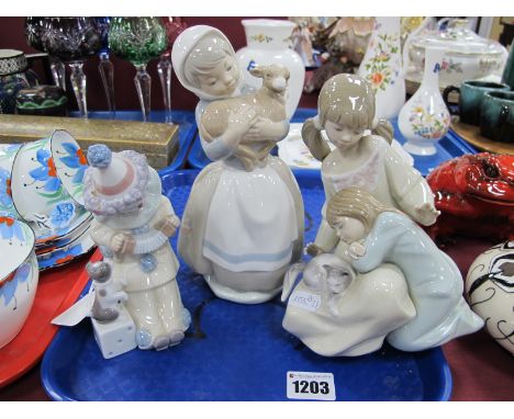 Lladro Figurines - Girls Admiring Cat, B-2N (finger chip) and Clown, 14.5cm high; Nao Girl Holding Lamb. (3)