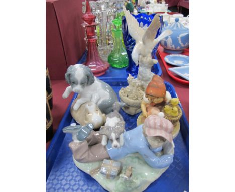 A Lladro Figure of a Boy wih Puppy, a Nao figure group of two puppies, a bird figure and Hummel Girl with Chicks. (4)
