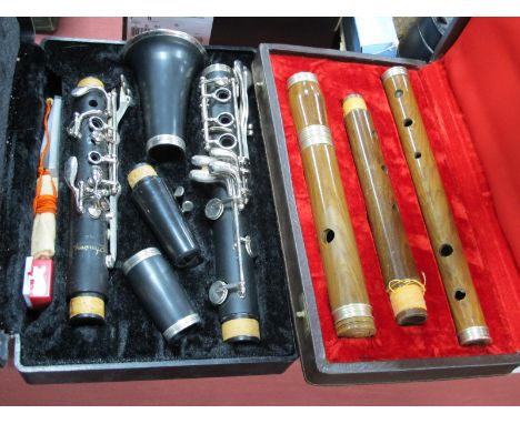 Armstrong Five Piece Clarinet, three piece flute, both cased. (2)