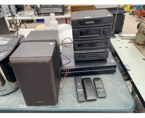 A TOSHIBA DVD/VHS RECORDER AND A PANASONIC STEREO SYSTEM WITH TWO SPEAKERS 